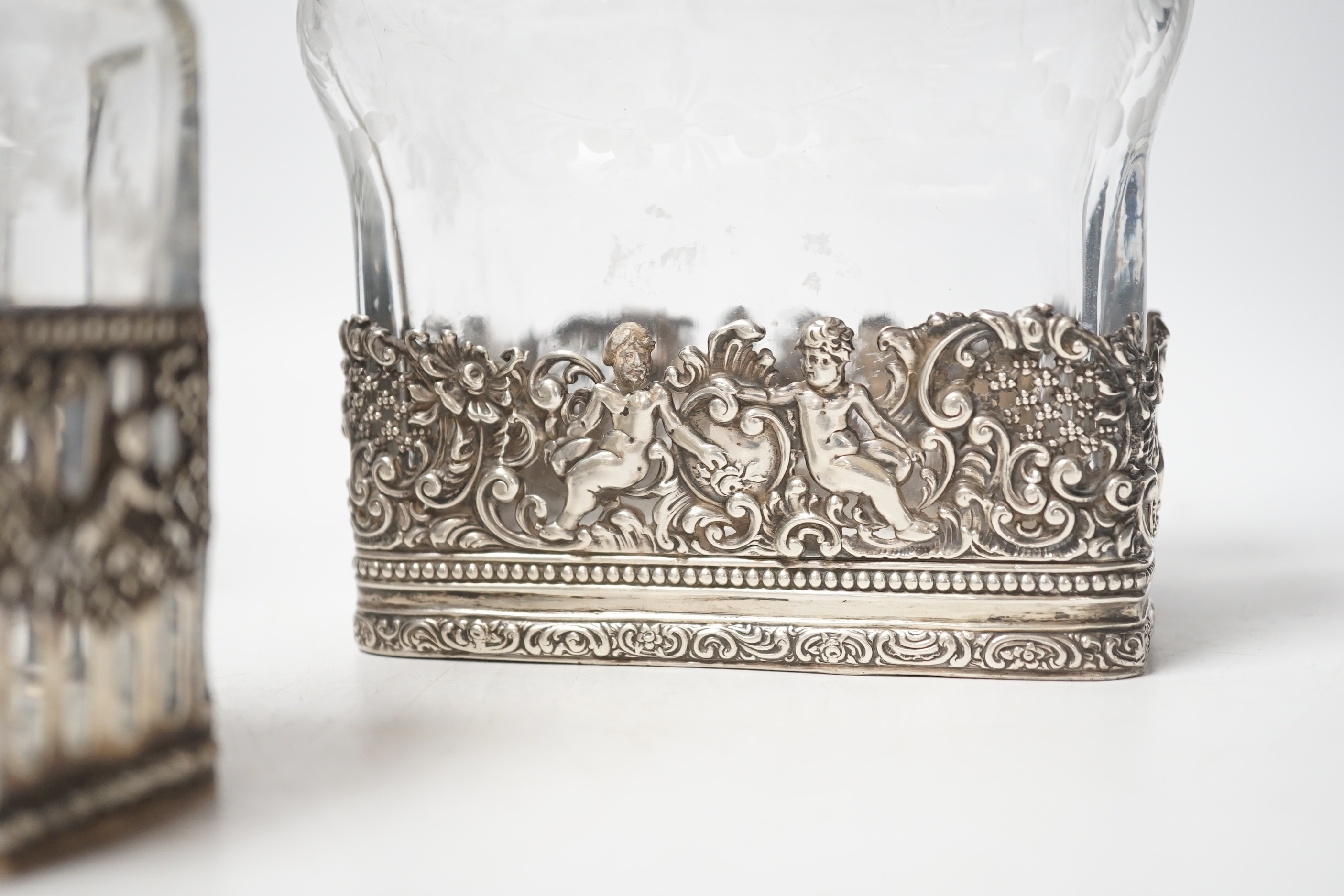 A George V Hanau silver mounted etched glass three piece decanter suite, import marks for Berthold Hermann Muller, London, 1912, tallest 26.5cm (neck broken).